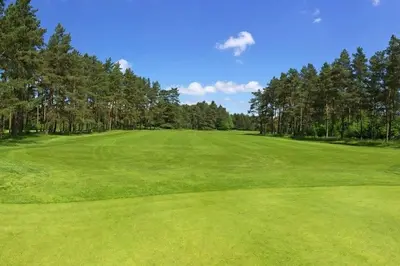 a green field with trees on a golf course at 5 min des plages - Appt 2 chambres A Casa Bella in Lucciana
