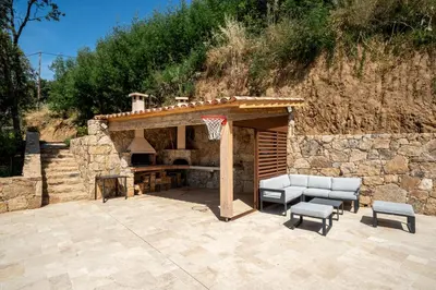 a patio with a basketball hoop and a basketball hoop at Villa Toci in Calcatoggio