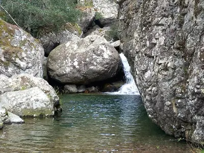 a stream of water in a rocky area with rocks at maison de vacances olmi cappella Corse in Olmi-Cappella