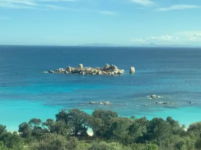 a group of rocks in the water with trees at BandB les rosiers - Hellébore in Conca