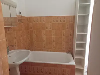 a bathroom with a bath tub and a sink at Lemon in Casaglione