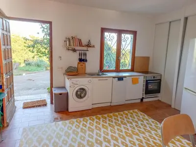 a kitchen with a washing machine and a washer at Lemon in Casaglione