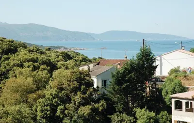 a town with a view of a body of water at Holiday Home Sagone Xlvii in Sagone