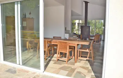a dining room with a wooden table and chairs at Cozy Home In San Giuliano With Wifi in San-Giuliano