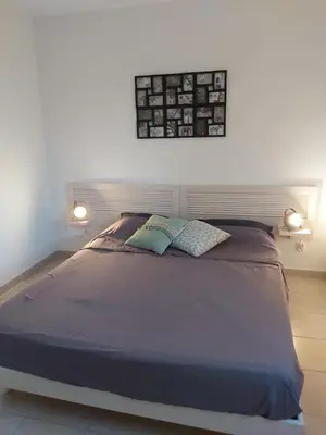 a bed with two pillows on it in a bedroom at Ville melody in San-Nicolao