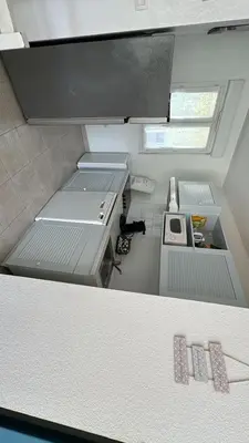 an overhead view of a kitchen in a small room at Ville melody in San-Nicolao