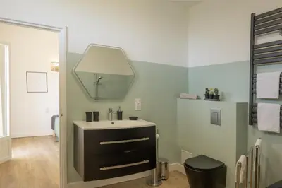 a bathroom with a sink and a mirror at Villa Jeanne in Linguizzetta
