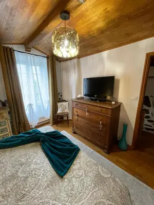 a bedroom with a bed and a tv on a dresser at a stalla in Valle d'Alesani