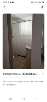 a bathroom with a white sink and a shower at Rez de villa avec jardin in Porto-Vecchio