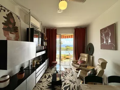 a living room with a couch and a table at Appartement 2 pièces Le Versailles Ajaccio Sanguinaires in Ajaccio
