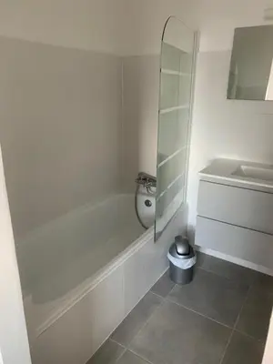 a white bathroom with a tub and a sink at Corsicadream cupabia, appartement dans villa proche Porticcio, vue mer, piscine in Pietrosella