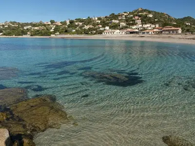 a large body of water with a beach at Villa U Rustincu Vue mer Acces plage Ruppione Pietrosella in Pietrosella