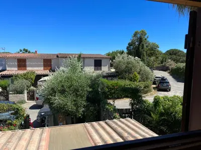 a view from a window of a parking lot at Pavillon chez Michel corse in Poggio-Mezzana