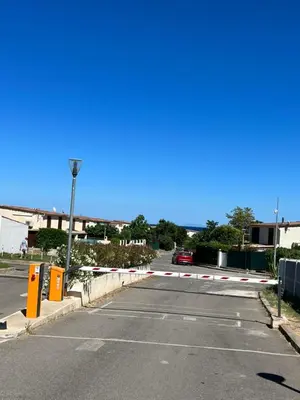 an empty parking lot with a car parked in it at Pavillon chez Michel corse in Poggio-Mezzana