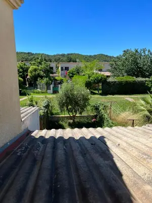a shadow of a roof on a house at Pavilllon en corse chez Michel in Poggio-Mezzana
