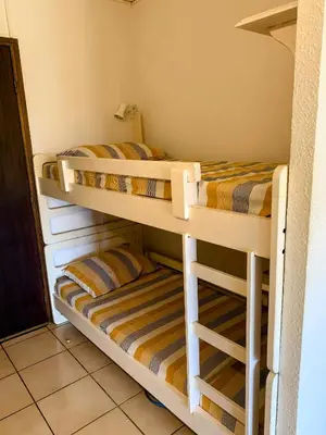 two bunk beds in a small room at Chez Aline - Appartement en bord de mer in Cervione
