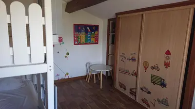 a small room with a table and a door at Villa vue mer 400m plages et commerces calme confort pour 6 à 8 personnes soins de remise en forme possible in Propriano