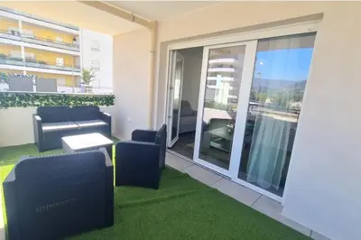 a view of a mountain with cars parked on a road at T2 apartment with terrace in Ajaccio