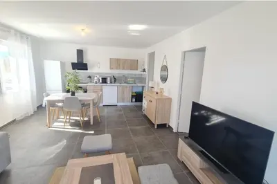 a bedroom with a bed and a large window at T2 apartment with terrace in Ajaccio