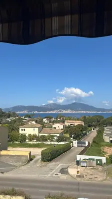 a view from a window of a city with a road at Studio PORTICCIO in Porticcio