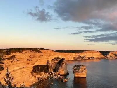 a large body of water with some rocks in it at A Nepita - 150m de la plage in Pietrosella
