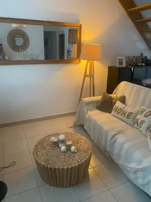 a living room with a couch and a table at La BénéCIOLA, vue Mer, Box Fibre SFR, High Speed Internet in Cervione