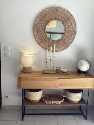 a dressing table with a mirror and a lamp on it at La BénéCIOLA, vue Mer, Box Fibre SFR, High Speed Internet in Cervione