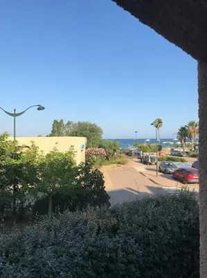 a view of a street with a parking lot at Studio bord de mer in Lecci