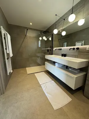 a bathroom with a sink and a shower at Villa Bavella in Zonza