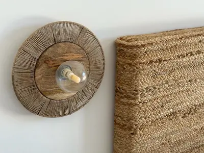 a wall mounted mirror with a bottle on a wall at Villa Bavella in Zonza
