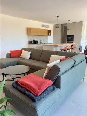a living room with a couch and a table at Casa Vitalba in Zonza
