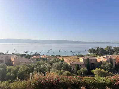 a view of a town with boats in the water at Studio front de Mer Sanguinaires in Ajaccio