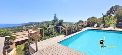 a swimming pool on a deck with a view of the ocean at O SOHNO 4 pers vue Mer Piscine in Sainte Trinité