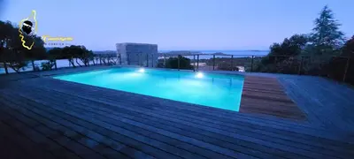 a swimming pool on top of a house at O SOHNO 4 pers vue Mer Piscine in Sainte Trinité