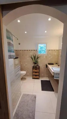 a bathroom with a sink and a tub and a toilet at Casa di leo in Figari