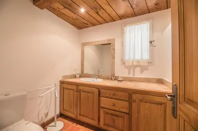 a bathroom with a sink and a toilet at Villa Tavara Di Porto-Vecchio in Porto-Vecchio