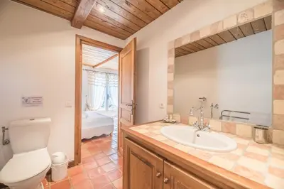 a bathroom with a toilet and a sink at Villa Tavara Di Porto-Vecchio in Porto-Vecchio