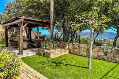 a garden with a gazebo and a tree at Villa Tavara Di Porto-Vecchio in Porto-Vecchio