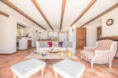 a living room with a couch and two chairs at Villa Funtanedda Di Porto-Vecchio in Porto-Vecchio