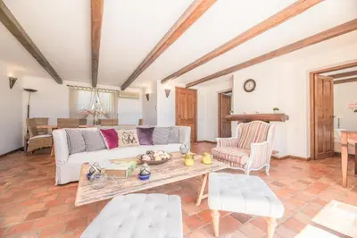 a living room with a couch and a table at Villa Funtanedda Di Porto-Vecchio in Porto-Vecchio