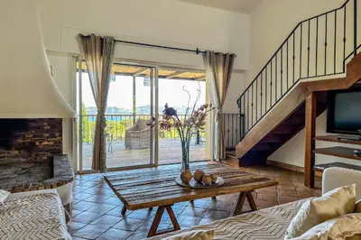 a living room with a vase of fruit on a table at Villa Casteddu Di Porto-Vecchio in Porto-Vecchio