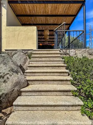 a set of stairs leading up to a house at Villa Casteddu Di Porto-Vecchio in Porto-Vecchio