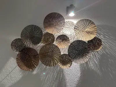 a group of umbrellas hanging from a ceiling at Les oliviers 6 - Appartement pieds dans l'eau in Porto-Vecchio