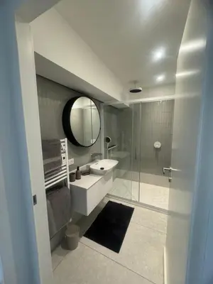 a bathroom with a sink and a mirror at T4 standing a Cargese in Cargèse