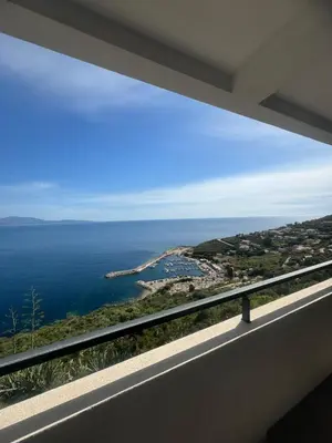 a view of the ocean from a balcony at T4 standing a Cargese in Cargèse
