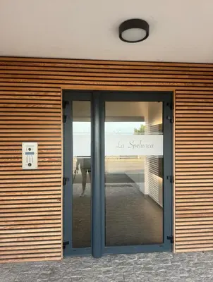 a door to a building with the words la sposa at T4 standing a Cargese in Cargèse