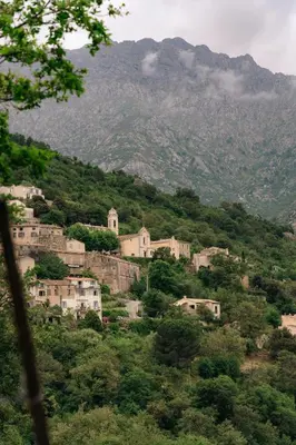 a village on a hill with a mountain at Domaine Acciola in Feliceto