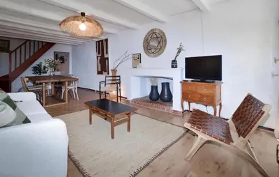 a living room with a couch and a tv at Cozy Home In Sollacaro With Wifi in Sollacaro