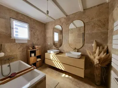 a hallway with a mirror and a table with a mirror at Comme à la maison in Sarrola-Carcopino