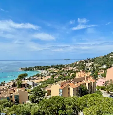 a view of a town with houses and the ocean at VUE EXCEPTIONNELLE - Ajaccio T3 rte Sanguinaires - Santa Lina in Ajaccio